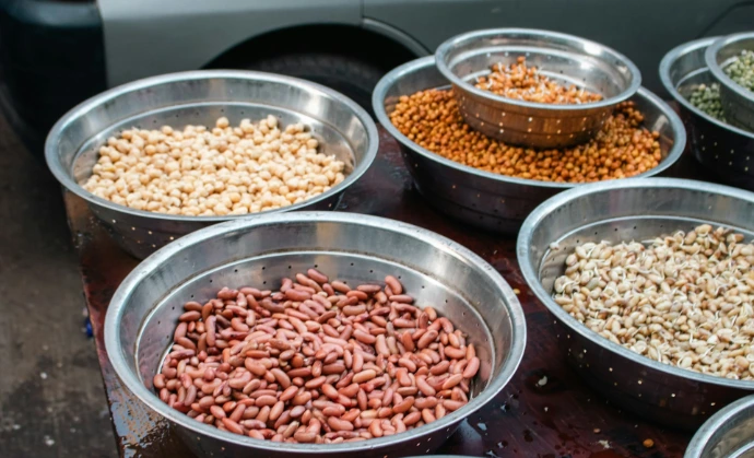 Bowls of assorted dried beans and legumes.